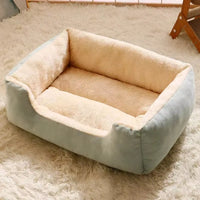 Pet bed in dusty pink shown on a wooden floor